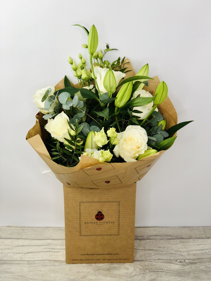 <h2>Beautiful White Celebration Bouquet - Hand-Delivered</h2>
<br>
<ul>
<li>Approximate Dimensions: 50cm x 30cm</li>
<li>Flowers arranged by hand and gift wrapped in our signature eco-friendly packaging and finished off with a hidden wooden ladybird</li>
<li>To give you the best occasionally we may make substitutes</li>
<li>Our flowers backed by our 7 days freshness guarantee</li>
<li>For delivery area coverage see below</li>
</ul>
<br>
<h2>Flower Delivery Coverage</h2>
<p>Our shop delivers flowers to the following Liverpool postcodes L1 L2 L3 L4 L5 L6 L7 L8 L11 L12 L13 L14 L15 L16 L17 L18 L19 L24 L25 L26 L27 L36 L70 If your order is for an area outside of these we can organise delivery for you through our network of florists. We will ask them to make as close as possible to the image but because of the difference in stock and sundry items it may not be exact.</p>
<br>
<h2>Hand-tied Bouquet | Flowers in box with water</h2>
<p>These beautiful flowers hand-arranged by our professional florists into a hand-tied bouquet are a delightful choice from our new collection. This white bouquet would make the perfect gift to celebrate any occasion.</p>
<p>Handtied bouquets are a lovely display of fresh flowers that have the wow factor. The advantage of having a bouquet made this way is that they are artfully arranged by our florists and tied so that they stay in the display.</p>
<p>They are then gift wrapped and aqua packed in a water bubble so that at no point are the flowers out of water. This means they look their very best on the day they arrive and continue to delight for days after.</p>
<p>Being delivered in a transporter box and in water means the recipient does not need to put the flowers in a vase straight away they can just put them down and enjoy.</p>
<p>Featuring 2 white oriental, 5 white roses, and 2 white lisianthus, together with mixed seasonal foliage including eucalyptus.</p>
<br>
<h2>Eco-Friendly Liverpool Florists</h2>
<p>As florists we feel very close earth and want to protect it. Plastic waste is a huge problem in the florist industry so we made the decision to make our packaging eco-friendly.</p>
<p>To achieve this we worked with our packaging supplier to remove the lamination off our boxes and wrap the tops in an Eco Flowerwrap which means it easily compostable or can be fully recycled.</p>
<p>Once you have finished enjoying your flowers from us they will go back into growing more flowers! Only a small amount of plastic is used as a water bubble and this is biodegradable.</p>
<p>Even the sachet of flower food included with your bouquet is compostable.</p>
<p>All our bouquets have small wooden ladybird hidden amongst them so do not forget to spot the ladybird and post a picture on our social media pages to enter our rolling competition.</p>
<br>
<h2>Flowers Guaranteed for 7 Days</h2>
<p>Our 7-day freshness guarantee should give you confidence that we will only send out good quality flowers.</p>
<p>Leave it in our hands we will create a marvellous bouquet which will not only look good on arrival but will continue to delight as the flowers bloom.</p>
<br>
<h2>Liverpool Flower Delivery</h2>
<p>We are open 7 days a week and offer advanced booking flower delivery same-day flower delivery 3-hour flower delivery. Guaranteed AM PM or Evening Flower Delivery and also offer Sunday Flower Delivery.</p>
<p>Our florists deliver in Liverpool and can provide flowers for you in Liverpool Merseyside. And through our network of florists can organise flower deliveries for you nationwide.</p>
<br>
<h2>The Best Florist in Liverpool your local Liverpool Flower Shop</h2>
<p>Come to Booker Flowers and Gifts Liverpool for your beautiful flowers and plants. For that bit of extra luxury we also offer a lovely range of finishing touches such as wines champagne locally crafted Gin and Rum Vases Scented Candles and Chocolates that can be delivered with your flowers.</p>
<p>To see the full range see our extras section.</p>
<p>You can trust Booker Flowers and Gifts of delivery the very best for you.</p>
<p><br /><br /></p>
<p><em>5 Star review on Yell.com</em></p>
<br>
<p><em>Thank you Gemma for your fabulous service. The flowers are of the highest quality and delivered with a warm smile. My sister was delighted. Ordering was simple and the communications were top-notch. I will definitely use your services again.</em></p>